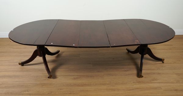 A GEORGE III MAHOGANY D-END EXTENDING DINING TABLE ON DUAL TRIPOD BASES