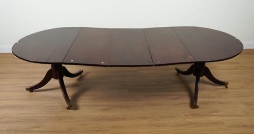 A GEORGE III MAHOGANY D-END EXTENDING DINING TABLE ON DUAL TRIPOD BASES