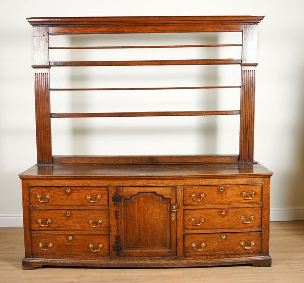 AN 18TH CENTURY OAK DRESSER WITH OPEN THREE TIER BACK OVER SINGLE CUPBOARD AND DRAWERS