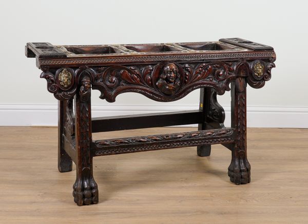 A 19TH CENTURY SPANISH BRASS MOUNTED CARVED WALNUT TRIPLE SECTION STAND ON PAW FEET