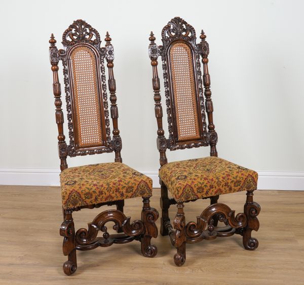 A PAIR OF 17TH CENTURY STYLE CARVED WALNUT HIGHBACK SIDE CHAIRS (2)