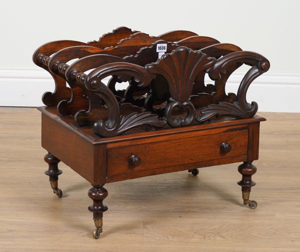 A VICTORIAN CARVED ROSEWOOD THREE DIVISION CANTERBURY WITH SINGLE DRAWER BASE