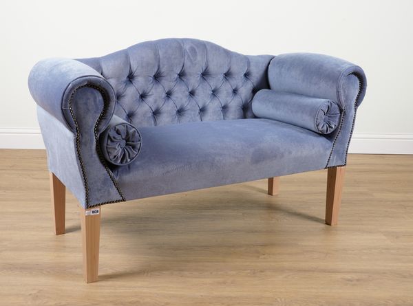 A REGENCY STYLE HUMP BACK WINDOW SEAT IN STUDDED BLUE UPHOLSTERY