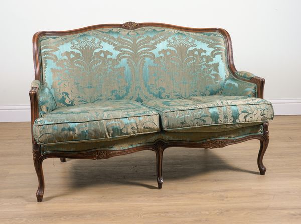 A LOUIS XV STYLE PARCEL GILT BEECH TWO SEAT SOFA