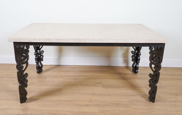 A RECTANGULAR MARBLE TOPPED CENTRE TABLE ON FOUR EBONISED PIERCED SCROLLWORK SUPPORTS