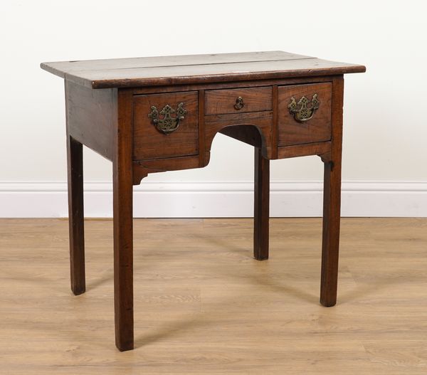 AN 18TH CENTURY OAK THREE DRAWER LOWBOY ON SQUARE SUPPORTS