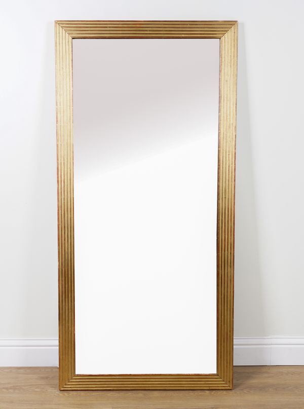 A 19TH CENTURY FRENCH REEDED GILT FRAMED RECTANGULAR MIRROR