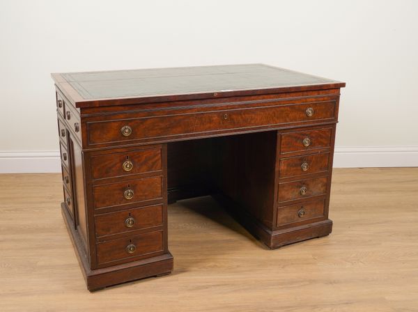 AN UNUSUAL 19TH CENTURY MAHOGANY ESTATE KNEEHOLE WRITING DESK WITH AN ARRANGEMENT OF TRUE AND DUMMY DRAWERS AND CUPBOARDS