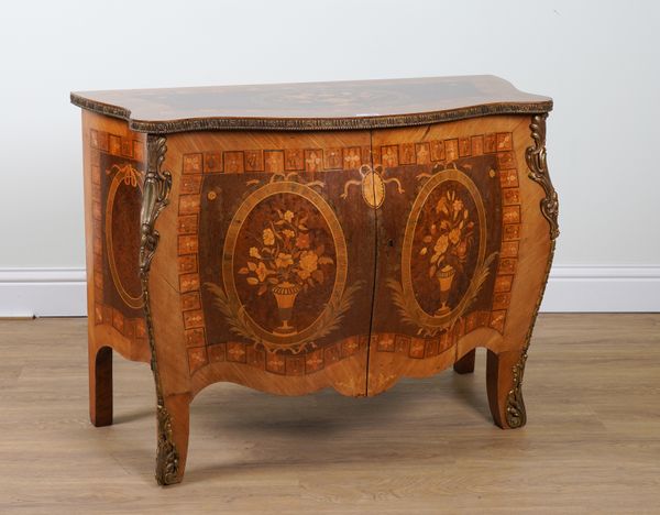 AN 18TH CENTURY FRENCH STYLE GILT METAL MOUNTED FLORAL MARQUETRY INLAID WALNUT AND AMBOYNA BOMBE TWO DRAWER COMMODE