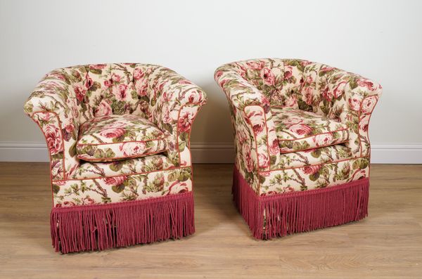 A PAIR OF EARLY 20TH CENTURY FLORAL UPHOLSTERED TUB BACK EASY CHAIRS