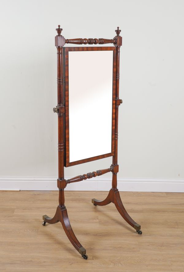 A REGENCY MAHOGANY CHEVAL MIRROR ON DOWNSWEPT SUPPORTS