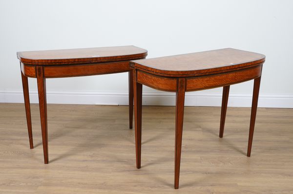 A PAIR OF GEORGE III KINGWOOD BANDED SATINWOOD D-SHAPED FOLD OVER CARD TABLES ON TAPERING SQUARE SUPPORTS (2)