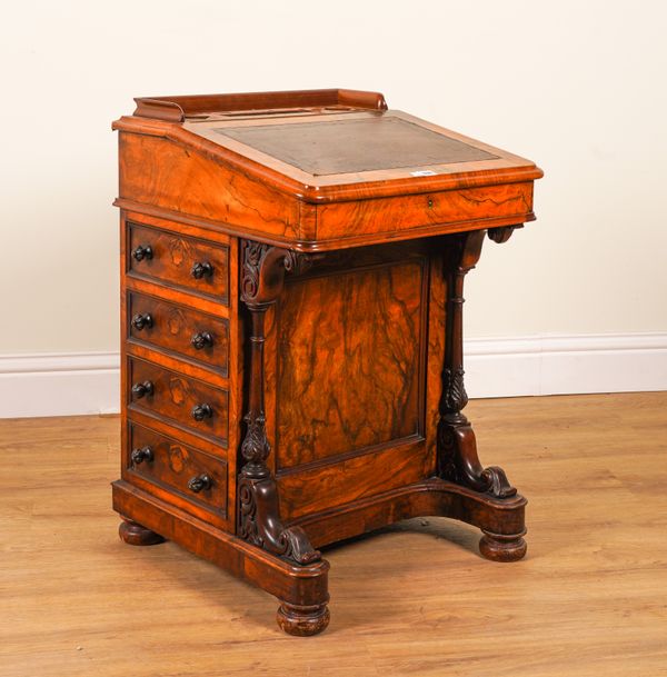 A VICTORIAN FIGURED WALNUT DAVENPORT WITH FOUR SIDE DRAWERS