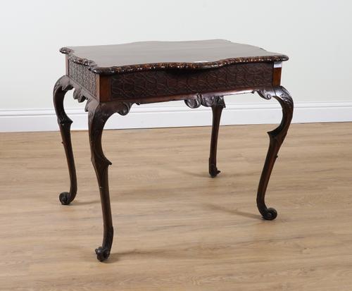 A PAIR OF 18TH CENTURY STYLE SHAPED AND CARVED MAHOGANY RECTANGULAR CENTRE TABLES ON SCROLL SUPPORTS (2)