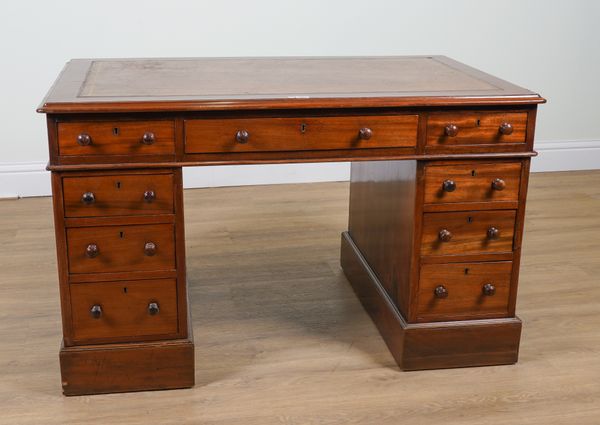 A 19TH CENTURY MAHOGANY NINE DRAWER PEDESTAL DESK