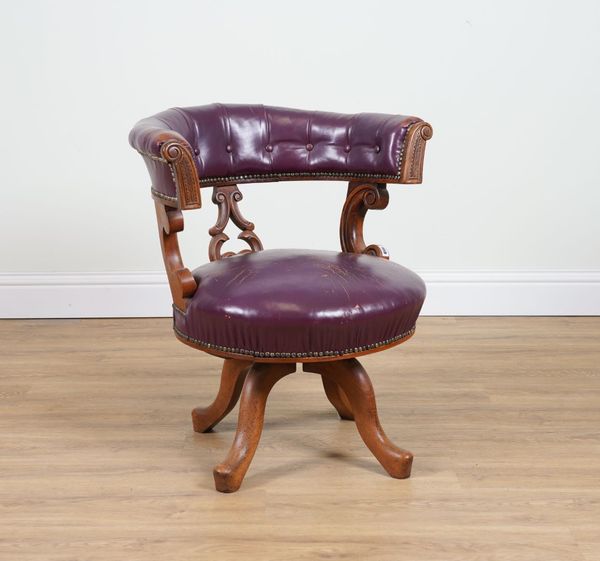 A VICTORIAN CARVED MAHOGANY FRAMED ROUGE LEATHER UPHOLSTERED TUB BACK SWIVEL DESK CHAIR