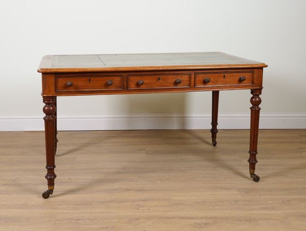 WITHDRAWN A MID 19TH CENTURY MAHOGANY THREE DRAWER LIBRARY TABLE ON FLUTED SUPPORTS