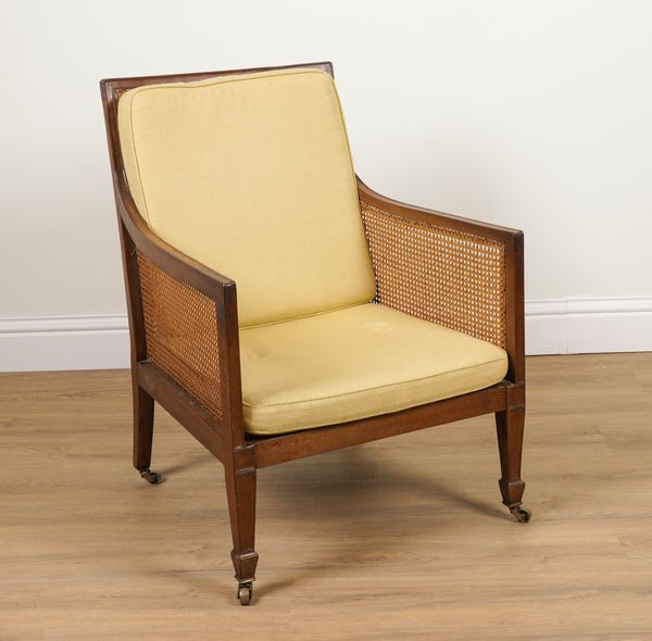 AN EARLY 19TH CENTURY MAHOGANY FRAMED LIBRARY BERGERE CHAIR