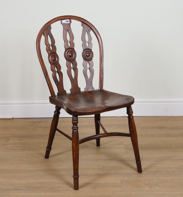 A 19TH CENTURY ELM AND YEW TRIPLE BULL’S EYE BACK WINDSOR CHAIR WITH CRINOLINE STRETCHER