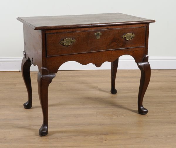 AN 18TH CENTURY OAK SINGLE DRAWER LOWBOY ON POINTED PAD FEET