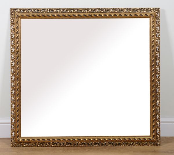 A RECTANGULAR ETCHED GLASS WALL MIRROR WITH BEVELLED PLATE AND GILT FRAME