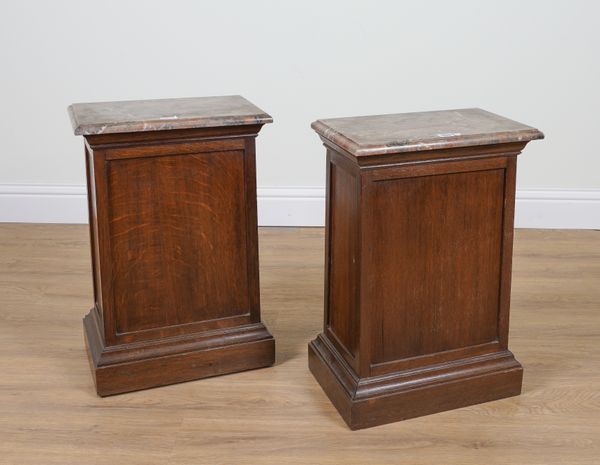 A PAIR OF RECTANGULAR MARBLE TOPPED OAK STANDS (2)