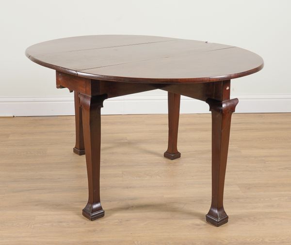 A GEORGE II MAHOGANY OVAL DROP FLAP SUPPER TABLE