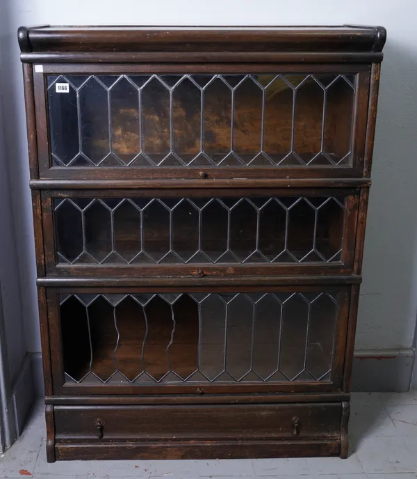 GLOBE-WERNICKE; A MID 20TH CENTURY OAK LEADED GLASS THREE SECTION BOOKCASE