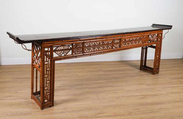 A LARGE EARLY 20TH CENTURY LACQUERED SOFTWOOD AND BAMBOO ALTAR TABLE