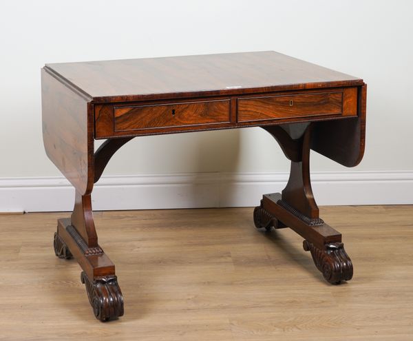 IN THE MANNER OF GILLOWS; A REGENCY ROSEWOOD TWO DRAWER DROP FLAP SOFA TABLE