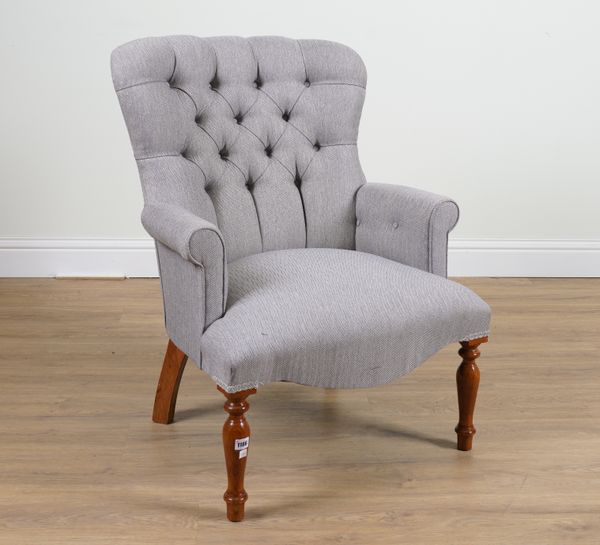 A VICTORIAN STYLE SPOONBACK EASY ARMCHAIR WITH DOGTOOTH UPHOLSTERY ON TURNED BALUSTER SUPPORTS