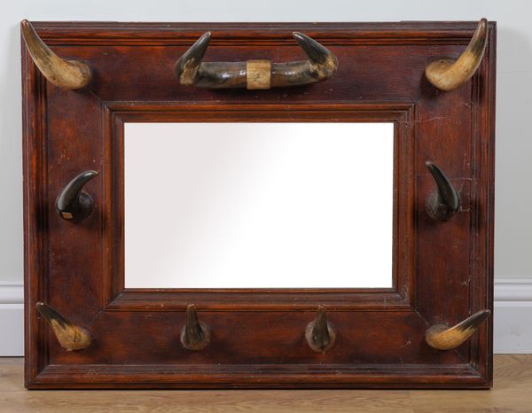 A HORN MOUNTED OAK FRAMED RECTANGULAR WALL MIRROR