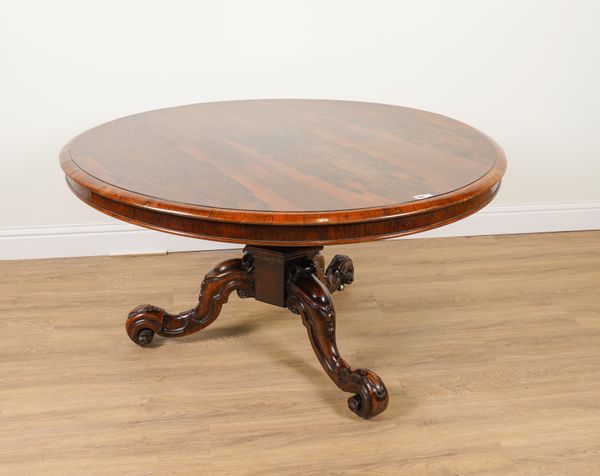 AN EARLY VICTORIAN ROSEWOOD CIRCULAR SNAP TOP OCCASIONAL TABLE ON CARVED TRIPOD BASE