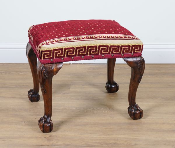 AN 18TH CENTURY STYLE WALNUT FRAMED RECTANGULAR FOOTSTOOL ON CLAW AND BALL FEET