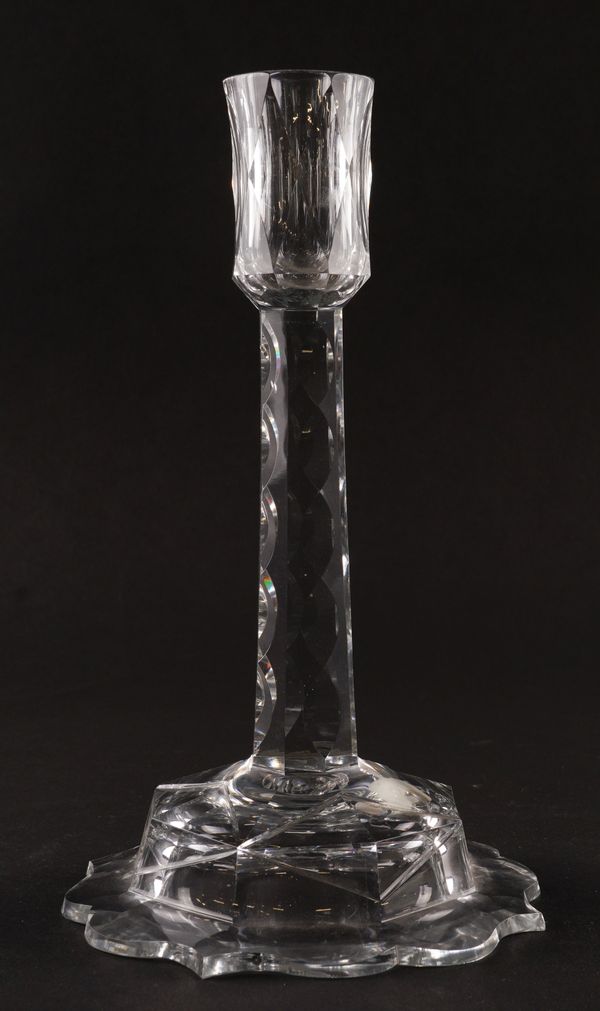 A TALL CUT GLASS CANDLESTICK