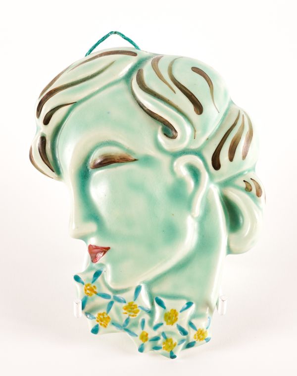 A SMALL CLARICE CLIFF CELADON GLAZED WALL MASK