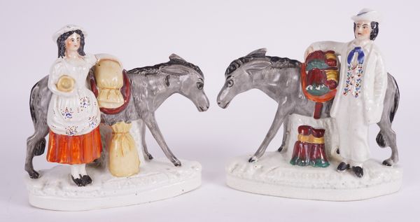 A PAIR OF STAFFORDSHIRE POTTERY GROUPS TITLED `SAND' AND `BEESUMS' (2)