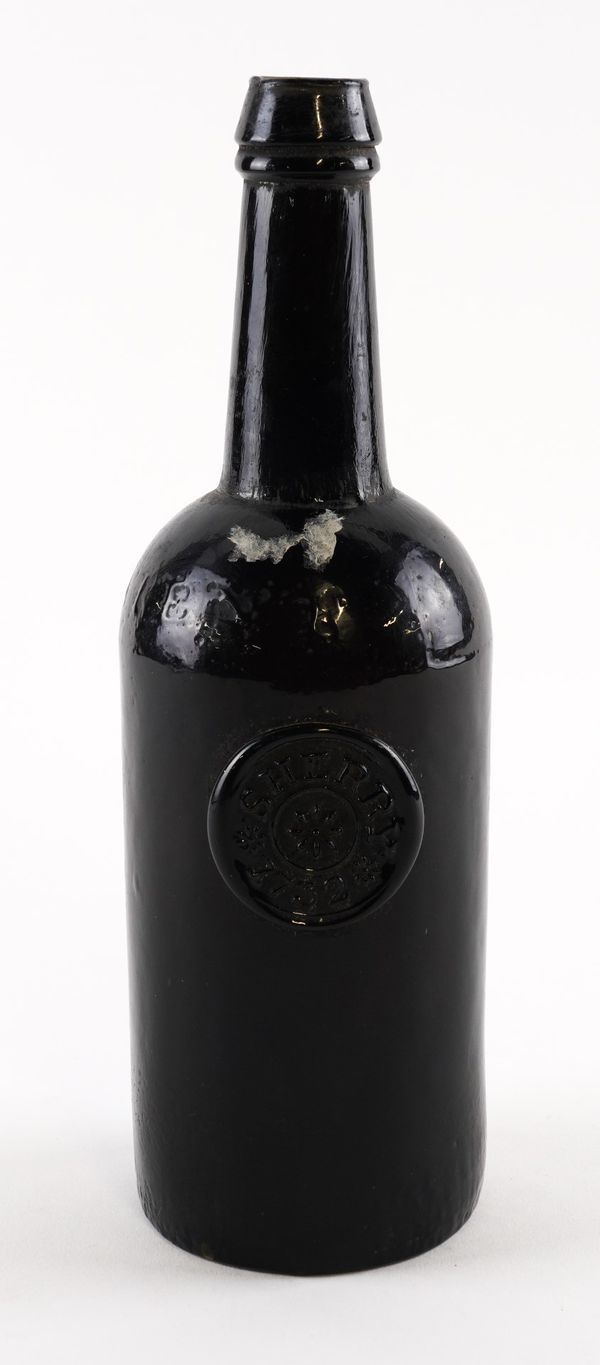 A RICKETTS & CO. SEALED GLASS BOTTLE