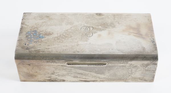 A SILVER RECTANGULAR TABLE CIGARETTE BOX