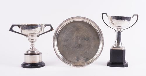 A SILVER WAITER AND TWO SILVER TROPHY CUPS (3)