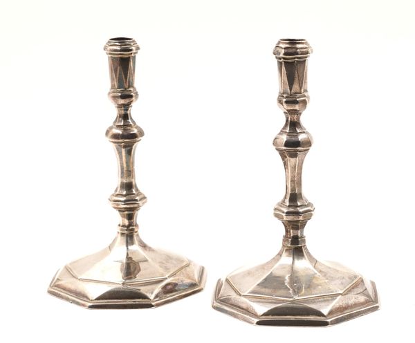 A PAIR OF QUEEN ANNE BRITANNIA STANDARD SILVER TAPERSTICKS