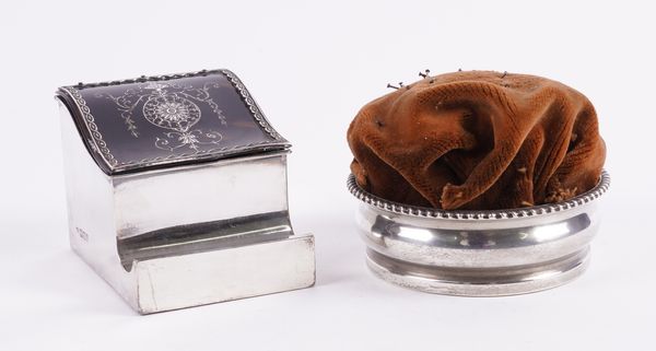 A TORTOISESHELL AND SILVER PIQUE INKWELL AND A SILVER PIN CUSHION FRAME (2)