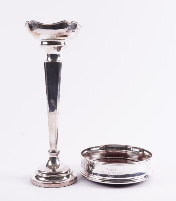 A SILVER VASE AND A SILVER MOUNTED BOTTLE COASTER (2)