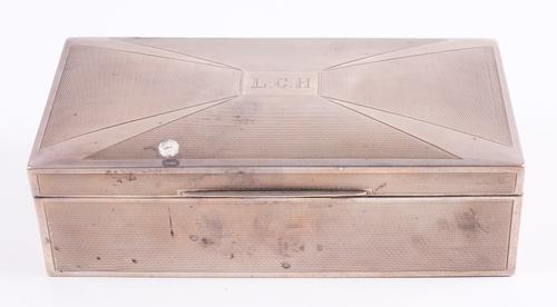 A SILVER RECTANGULAR TABLE CIGARETTE BOX