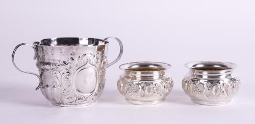 A BRITANNIA STANDARD LATE QUEEN ANNE SILVER TWIN HANDLED PORRINGER AND PAIR OF SILVER SALTS (3)