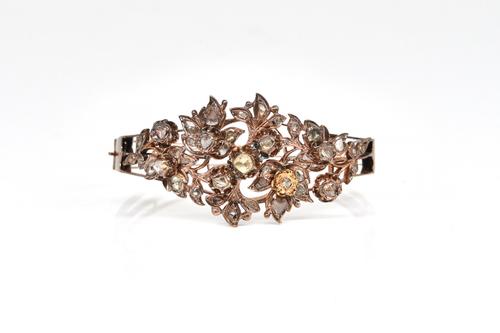 A DIAMOND SET OVAL HINGED BANGLE