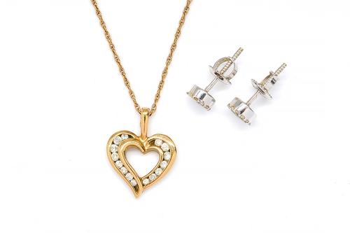 A 9CT GOLD AND DIAMOND HEART SHAPED PENDANT WITH A NECKCHAIN AND A PAIR OF DIAMOND CLUSTER EARSTUDS (3)