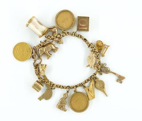 A GOLD CHARM BRACELET
