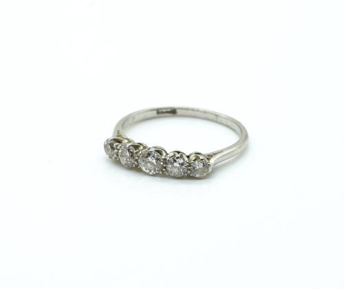 A PLATINUM AND DIAMOND FIVE STONE RING