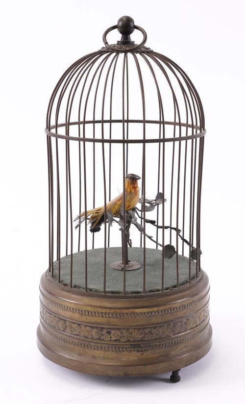 A SINGING BIRD AUTOMATON IN BRASS CAGE